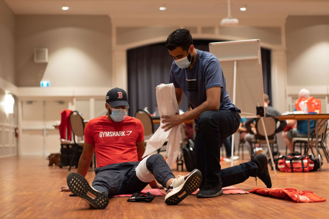 Pacific First Aid Instructors: Experts guiding students through hands-on first aid simulations